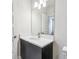 Stylish bathroom featuring a dark vanity, quartz countertop, and a bright mirror, creating a welcoming space at 2206 N Boulevard, Tampa, FL 33602