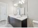 Modern bathroom featuring a double sink vanity, large mirror, and stylish lighting fixtures at 2206 N Boulevard, Tampa, FL 33602