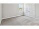 Bedroom featuring carpet, baseboards, a window, and a closet at 2206 N Boulevard, Tampa, FL 33602