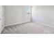 Cozy bedroom with neutral carpet and a window offering natural light at 2206 N Boulevard, Tampa, FL 33602