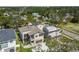 New construction home with a modern design, small balcony, and a well-manicured lawn at 2206 N Boulevard, Tampa, FL 33602