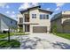 Contemporary two-story home featuring a two-car garage and modern architectural details at 2206 N Boulevard, Tampa, FL 33602