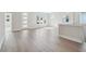 Bright hallway with hardwood floors, white trim, and natural light from the transom windows at 2206 N Boulevard, Tampa, FL 33602