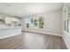 Open-concept living room featuring hardwood floors, white walls and plenty of natural light at 2206 N Boulevard, Tampa, FL 33602