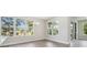 Bright living room with large windows, hardwood floors and a modern chandelier at 2206 N Boulevard, Tampa, FL 33602