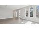 Open living space with hardwood floors, recessed lighting, and windows with neighborhood views at 2206 N Boulevard, Tampa, FL 33602