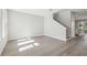 Bright living area with hardwood floors, a staircase, and windows at 2206 N Boulevard, Tampa, FL 33602