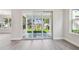 Bright living area with hardwood floors, large sliding glass doors to backyard, and view of the green lawn at 2206 N Boulevard, Tampa, FL 33602