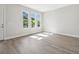 Bright living room featuring wood-look flooring, modern door, and scenic windows at 2206 N Boulevard, Tampa, FL 33602