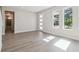 Bright living room with wood-look flooring, white walls, and modern front door and windows at 2206 N Boulevard, Tampa, FL 33602