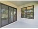 Covered patio with large sliding glass doors, and view of the backyard at 2206 N Boulevard, Tampa, FL 33602