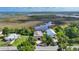 Stunning aerial view of property, showcasing the home, waterfront and lush surroundings at 4031 Eagle Nest Dr, Hernando Beach, FL 34607