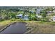 Waterfront homes with lush landscaping feature private pools and serene water views at 4031 Eagle Nest Dr, Hernando Beach, FL 34607