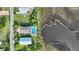 Aerial view of the property showcasing the home, pool and bay at 4031 Eagle Nest Dr, Hernando Beach, FL 34607
