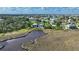Waterfront homes with lush landscaping feature private pools and serene water views at 4031 Eagle Nest Dr, Hernando Beach, FL 34607
