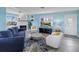 Cozy living area with fireplace, wood floors, and waterfront views at 4031 Eagle Nest Dr, Hernando Beach, FL 34607