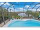 Screened pool area with marsh views, offering a relaxing outdoor space at 4031 Eagle Nest Dr, Hernando Beach, FL 34607