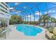 Enclosed pool area with comfortable seating and views of the open water offering the perfect outdoor getaway at 4031 Eagle Nest Dr, Hernando Beach, FL 34607
