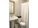 Simple bathroom with pedestal sink and shower at 1411 E Powhatan Ave, Tampa, FL 33604