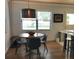Dining area with round table and four chairs at 1411 E Powhatan Ave, Tampa, FL 33604