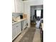 Bright kitchen with a view into the home gym at 1411 E Powhatan Ave, Tampa, FL 33604
