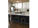 Modern kitchen with island, stainless steel appliances, and white cabinets at 1411 E Powhatan Ave, Tampa, FL 33604
