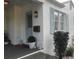 House exterior with light blue door and white siding at 1411 E Powhatan Ave, Tampa, FL 33604
