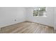 Bright bedroom with laminate wood flooring and window at 9009 Westchester Cir # B-18, Tampa, FL 33604