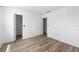 Bright bedroom with wood-look floors and spacious closet at 9009 Westchester Cir # B-18, Tampa, FL 33604
