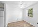 Simple bedroom with laminate flooring and a window at 9009 Westchester Cir # B-18, Tampa, FL 33604