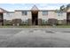 Exterior view of a two-story apartment building with brick and stucco at 9009 Westchester Cir # B-18, Tampa, FL 33604