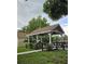 Wooden gazebo with brown roof and wooden railing at 6404 Land O Lakes Blvd., Land O Lakes, FL 34638