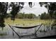 Relaxing hammock on a dock overlooking a tranquil lake at 6404 Land O Lakes Blvd., Land O Lakes, FL 34638