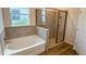 Modern bathroom featuring a stand alone tub and glass enclosed shower at 18146 Beach Ranch Ter, Lakewood Ranch, FL 34211