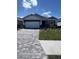 Charming single-story home with a paver driveway and a two-car garage at 18146 Beach Ranch Ter, Lakewood Ranch, FL 34211