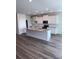 Modern kitchen with a large island, stainless steel appliances, and granite countertops at 18146 Beach Ranch Ter, Lakewood Ranch, FL 34211