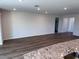 Spacious living room with luxury vinyl plank flooring, recessed lighting, and neutral paint at 18146 Beach Ranch Ter, Lakewood Ranch, FL 34211