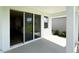 Covered patio with access to the kitchen through sliding glass doors at 18146 Beach Ranch Ter, Lakewood Ranch, FL 34211
