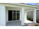 Covered patio with views of the backyard from the sliding glass doors at 18146 Beach Ranch Ter, Lakewood Ranch, FL 34211