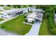 Aerial view of property showing home, yard, and driveway at 5116 Curran St, Zephyrhills, FL 33542