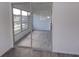 Bright sunroom with sliding glass doors and gray flooring at 1433 S Belcher Rd # A8, Clearwater, FL 33764