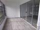 Sunroom with gray vinyl plank flooring at 1433 S Belcher Rd # A8, Clearwater, FL 33764