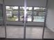 Sunroom with sliding glass doors and pool view at 1433 S Belcher Rd # A8, Clearwater, FL 33764