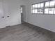 Simple bedroom with gray flooring and access to bathroom at 1433 S Belcher Rd # A8, Clearwater, FL 33764