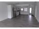 Open living room showcasing a modern kitchen and an open floor plan at 1433 S Belcher Rd # A8, Clearwater, FL 33764