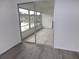 Spacious sunroom with sliding glass doors and view of the outdoors at 1433 S Belcher Rd # A8, Clearwater, FL 33764