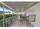 Covered patio with table and chairs, perfect for outdoor dining at 5116 Curran St, Zephyrhills, FL 33542