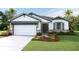 One-story home with two-car garage and landscaping at 18146 Beach Ranch Ter, Lakewood Ranch, FL 34211