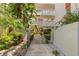 Landscaped walkway and entrance to condo building at 2630 Pearce Dr # 404, Clearwater, FL 33764