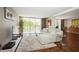 Light-filled living room featuring a sectional sofa and hardwood floors at 2630 Pearce Dr # 404, Clearwater, FL 33764